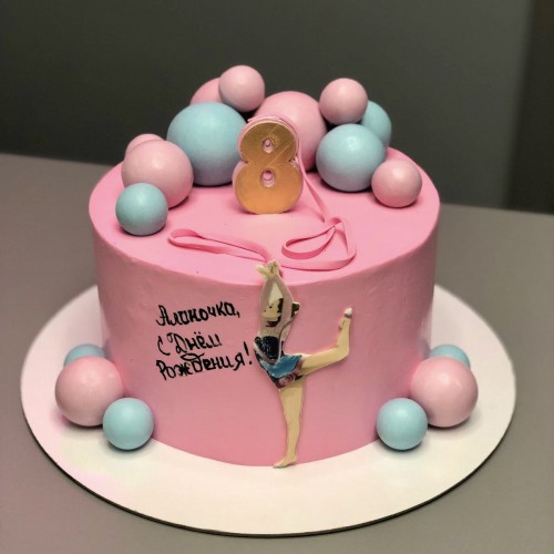 Торт для девочек #2586 с картинкой гимнастка и шоколадными шариками, розовый